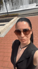 Woman documents fountain visit with selfies in Pleven, Bulgaria