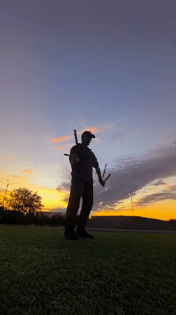 Nunchaku practice at sunset in a Karaganda park