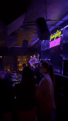 DJ in white bucket hat performs at Dalung nightclub