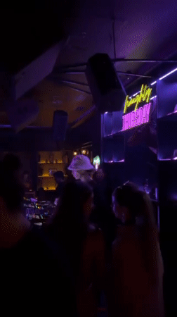 DJ in white bucket hat performs at Dalung nightclub