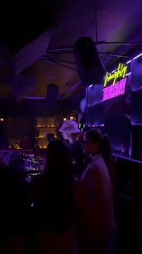 DJ in white bucket hat performs at Dalung nightclub