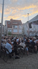 Live vocal performance at an outdoor concert in Hévíz