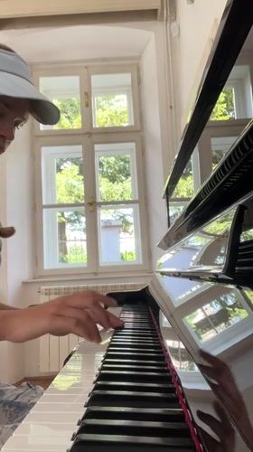 Woman plays piano, takes selfies in Cetinje music room