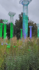 Illuminated translucent columns light up a Tallinn lawn