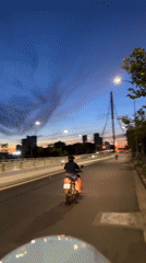 Cruising Đà Nẵng at dusk, Dragon Bridge in view