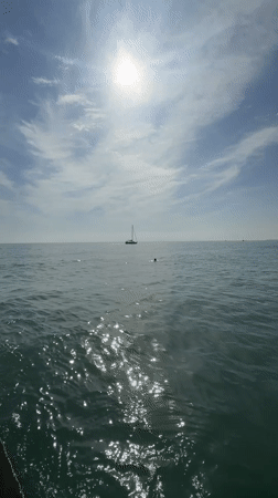 Afternoon fishing and boating activity captured at Sochi pier