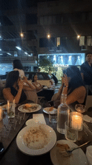 A Tel Aviv evening: dinner, street details, and a film poster