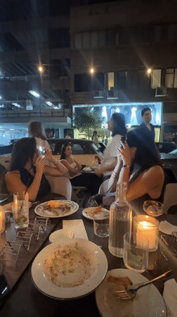A Tel Aviv evening: dinner, street details, and a film poster