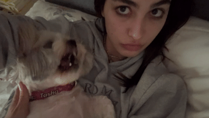 Woman and dog Tasha share bedtime moment in Mexico City