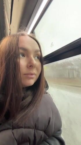 Woman rides bus on rainy morning in Krasnokamsk