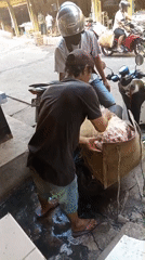 Morning market hustle in Karawang: produce, meat, and heavy loads