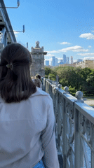Woman walks across bridge in Moscow