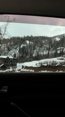 Car passenger films snowy Montenegro mountain landscape near Kolasin