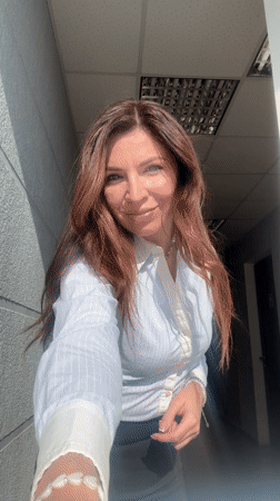 Woman in business attire observed in hallway