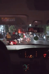 Heavy night traffic and street life in Malang, Indonesia