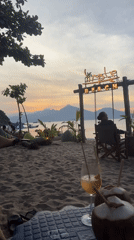 Beach bar sunset gathering with tropical drinks documented