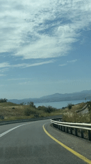 Car travels mountain road in Golan Heights region