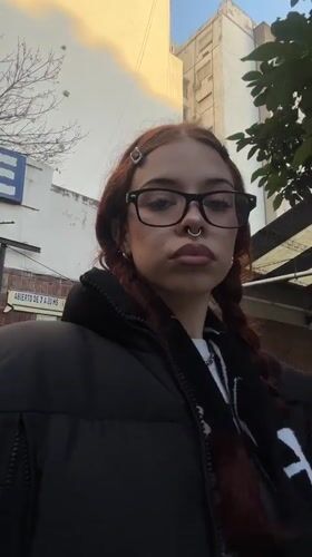 Red-haired person photographed on Buenos Aires street