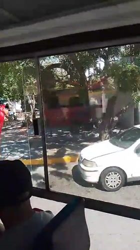 Bus passenger observes food truck area in Las Barrancas