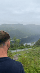 Man observes distant landscape in Dalen, Norway