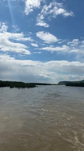 River flows past tree-covered islands near Kuragino, Russia
