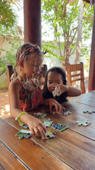 Children play indoors during morning hours in Mũi Né