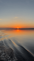 Sunset over water captured by witnesses in Votkinsk, Russia