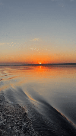 Sunset over water captured by witnesses in Votkinsk, Russia