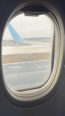 Aircraft taxis on wet runway at Moscow airport