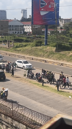 Crowd disturbance involving motorcycles disrupts Nairobi intersection traffic