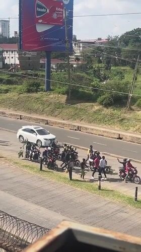Crowd disturbance involving motorcycles disrupts Nairobi intersection traffic