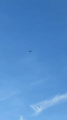 Paraglider spotted over Heilbronn landscape in evening sky