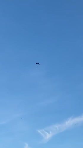 Paraglider spotted over Heilbronn landscape in evening sky