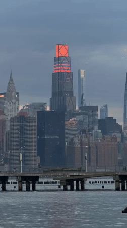 NYC skyline captured at dusk from waterfront pier