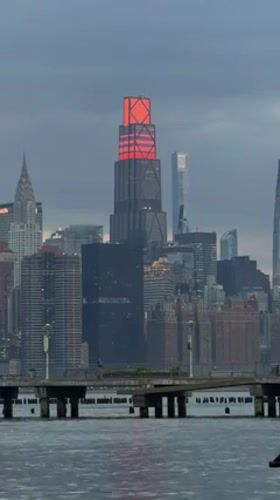 NYC skyline captured at dusk from waterfront pier