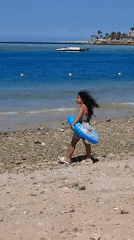 Family enjoys sunny beach day in Hurghada, Egypt