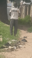 Midday life along dusty paths in a rural community