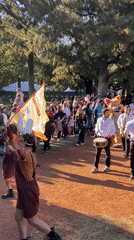 Costumed parade and performers entertain crowds at Buenos Aires park