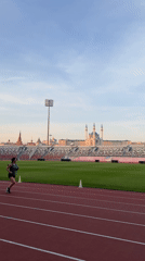 Runner trains at Kazan stadium near historic Kremlin complex