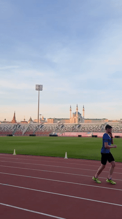 Runner trains at Kazan stadium near historic Kremlin complex