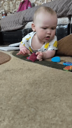 Quiet residential moments: baby, backyard playset, garden view