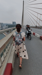 Pedestrians Walk, Photograph on Bai Chay Bridge Vietnam