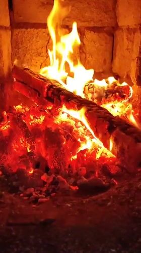 Fireplace burns with bright flames in Hrodna, Belarus