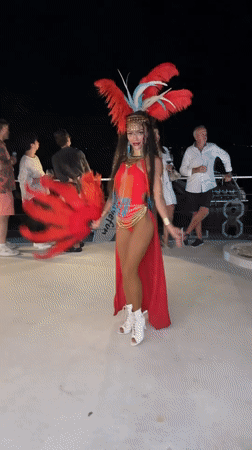 Poolside carnival night with fire dancers and costumed performers, Koh Samui