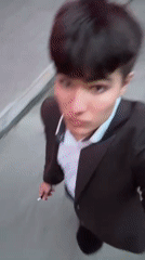 Man films himself near blooming tree in Kyiv