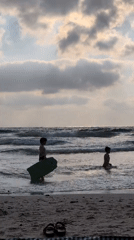 Late afternoon wind-down on Herzliya's Mediterranean beach at sunset