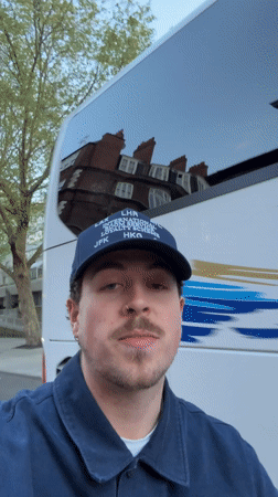 Man films selfie video on London street near bus