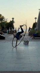 Alanya promenade, late afternoon: hoop performer, street life, golden hour