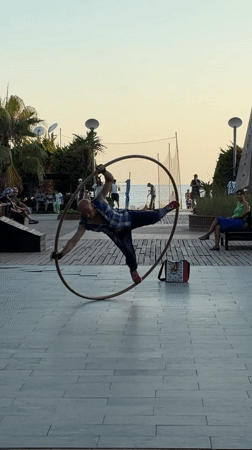 Alanya promenade, late afternoon: hoop performer, street life, golden hour