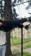 Two men interact outdoors in Berkovitsa, Bulgaria